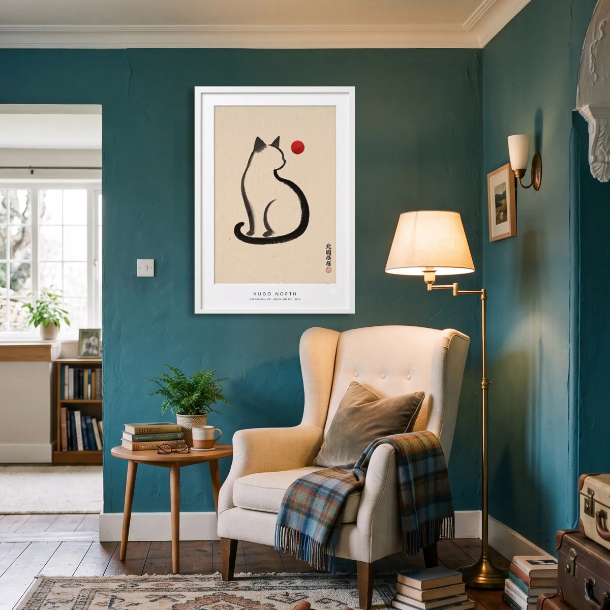 A framed print shown at three sizes above a reading chair